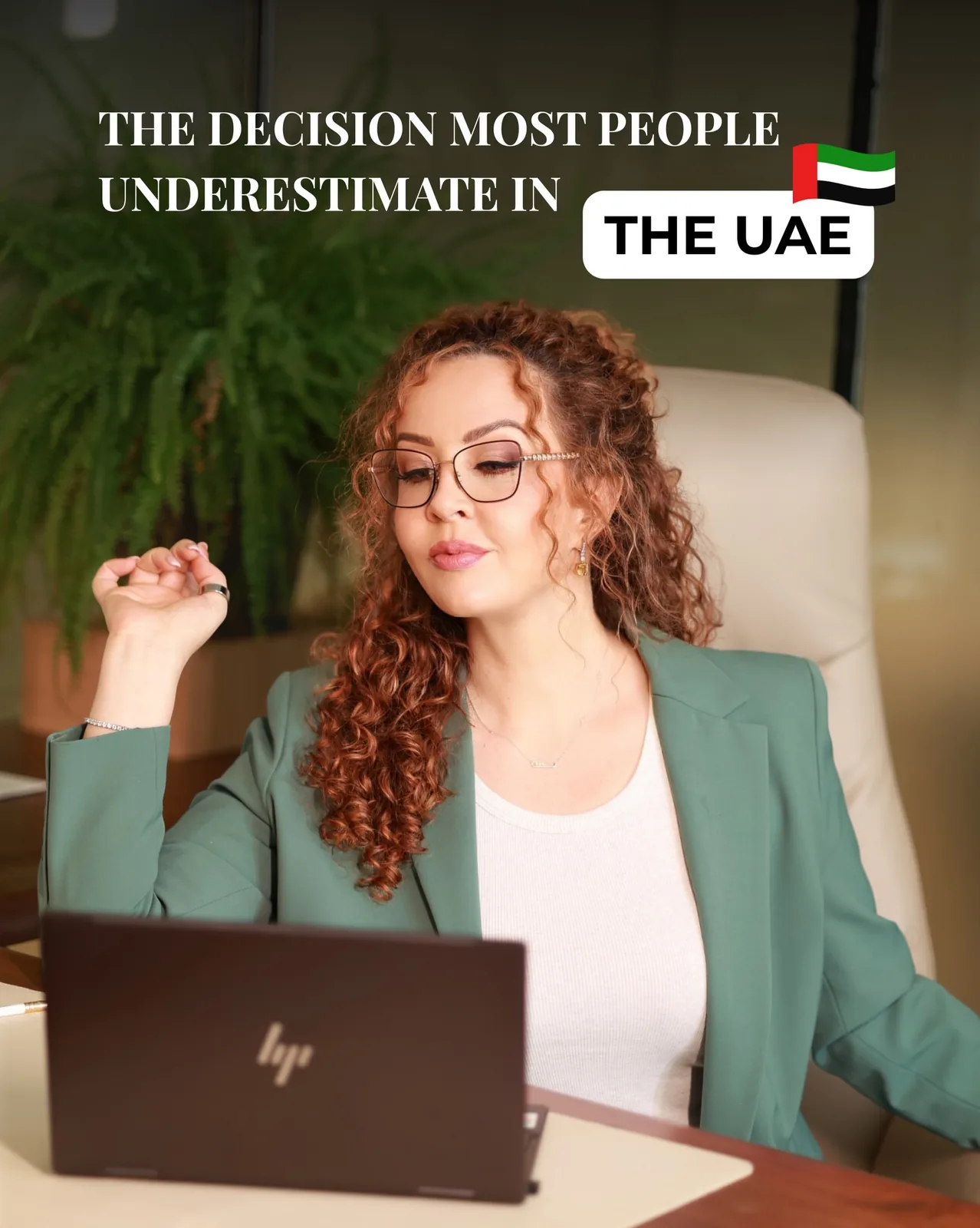 Professional woman working on a laptop in a UAE office setting, suggesting support for Web3 company setup and compliance