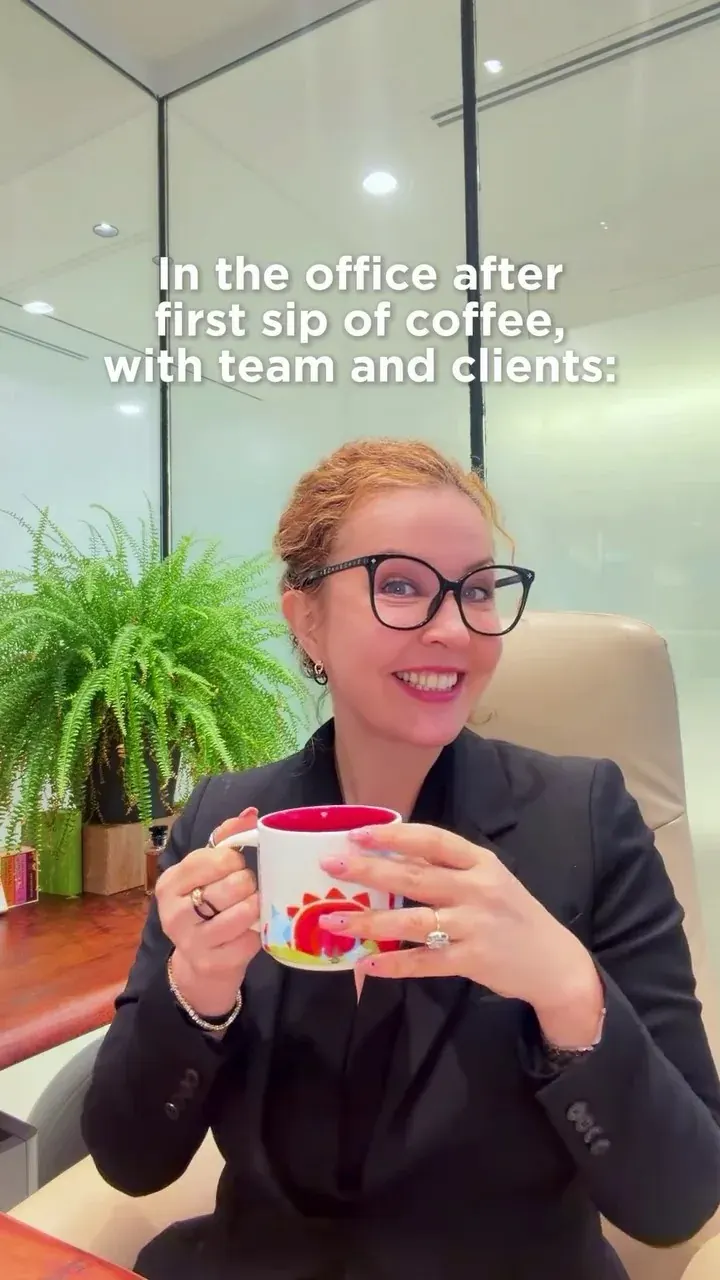 Professional woman in an office holding a mug, representing business setup support in the UAE Professional woman in an office holding a mug, representing business setup support in the UAE