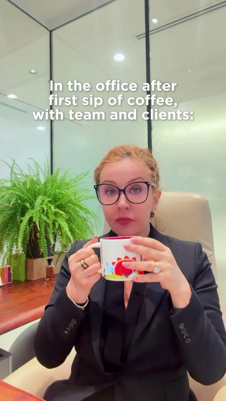 Professional woman in an office holding a mug, representing corporate structuring and SPV holding company work in the UAE
